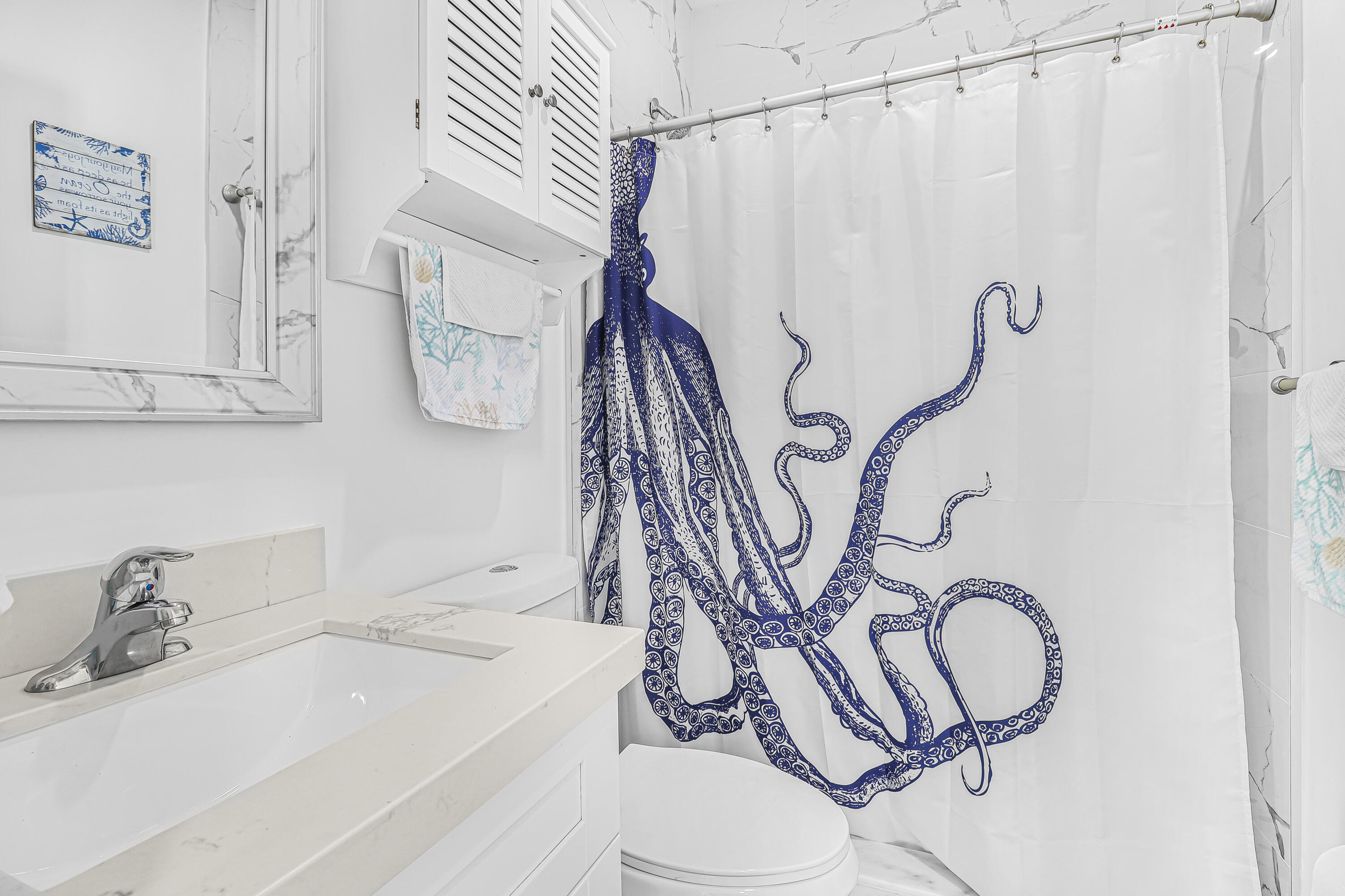 31575 Ave D Big Pine Key, FL 33043 - Photo 19 of 35 a bathroom with a sink toilet and shower