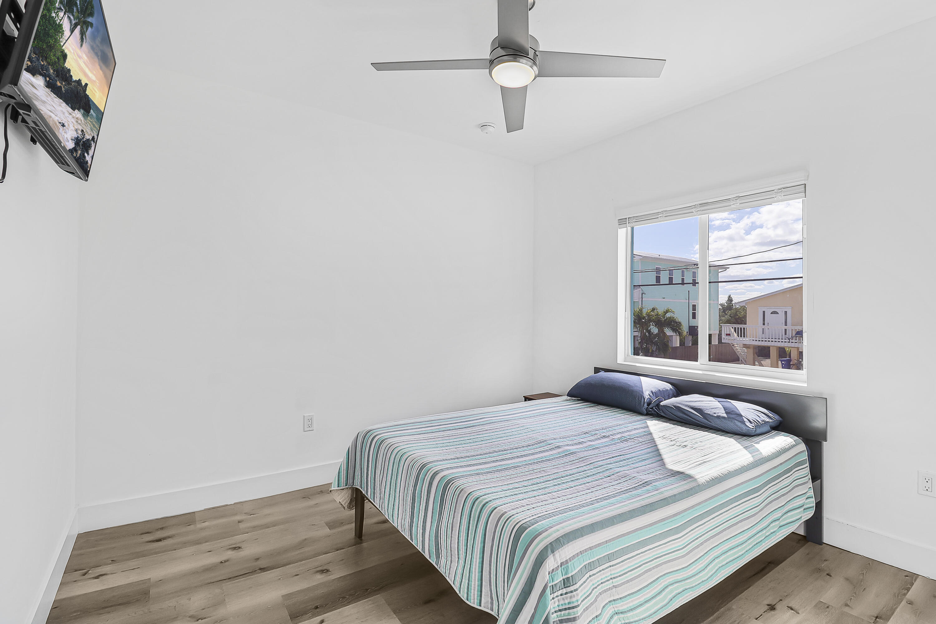 31575 Ave D Big Pine Key, FL 33043 - Photo 20 of 35 a bedroom with a bed and a window