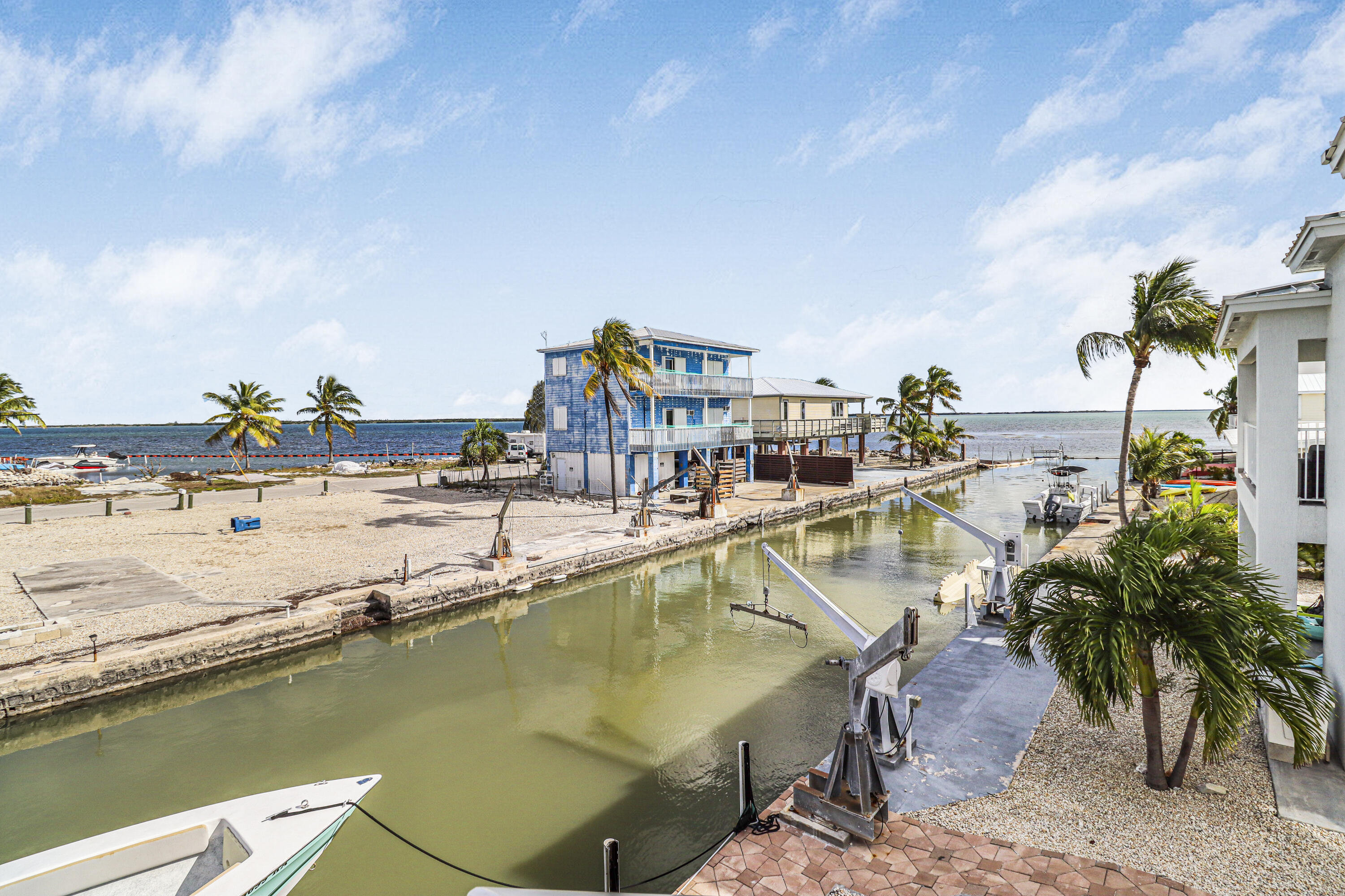 31575 Ave D Big Pine Key, FL 33043 - Photo 22 of 35 a view of a swimming pool with a lawn chairs