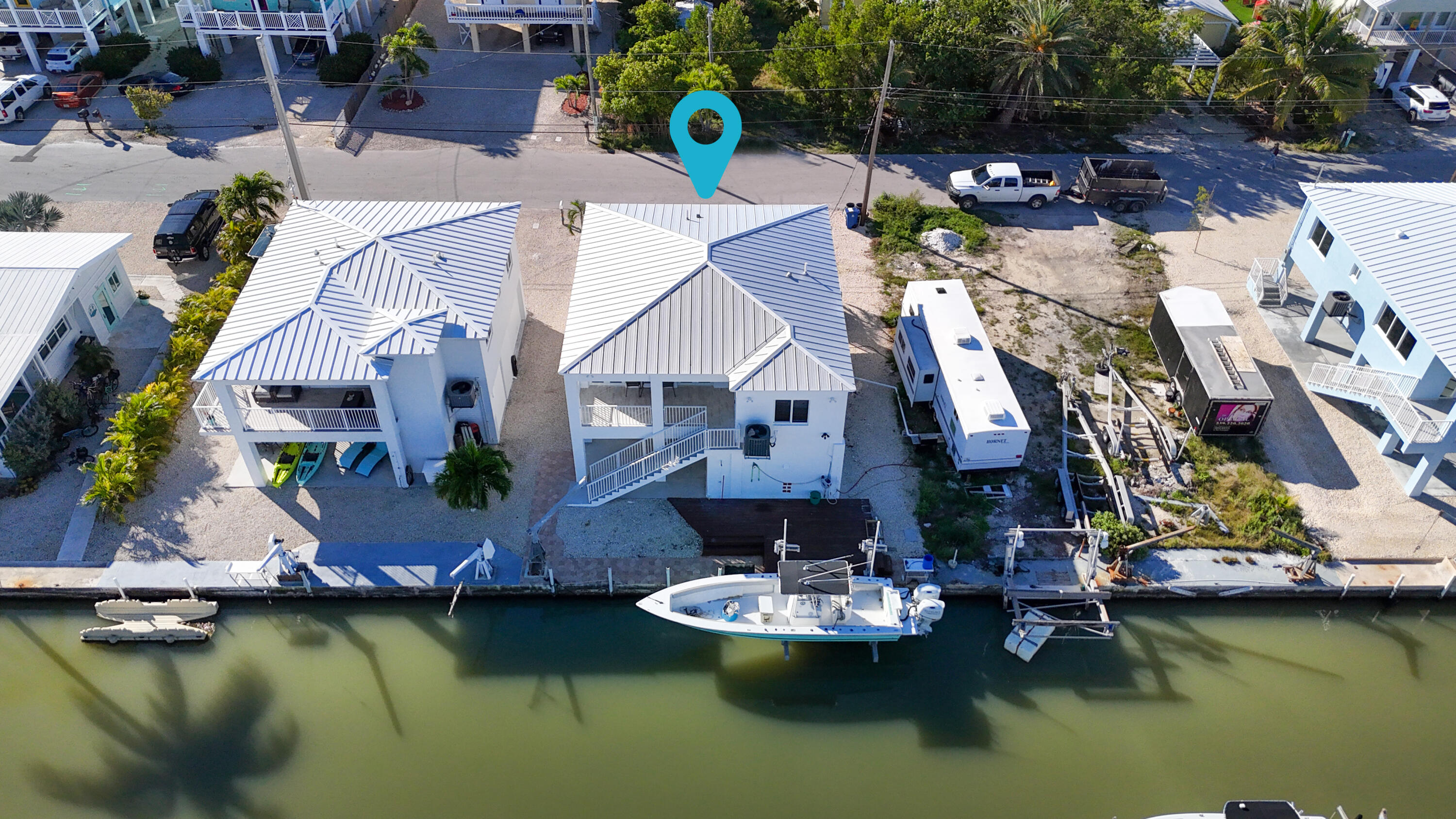 31575 Ave D Big Pine Key, FL 33043 - Photo 33 of 35 a aerial view of a house with swimming pool and outdoor space