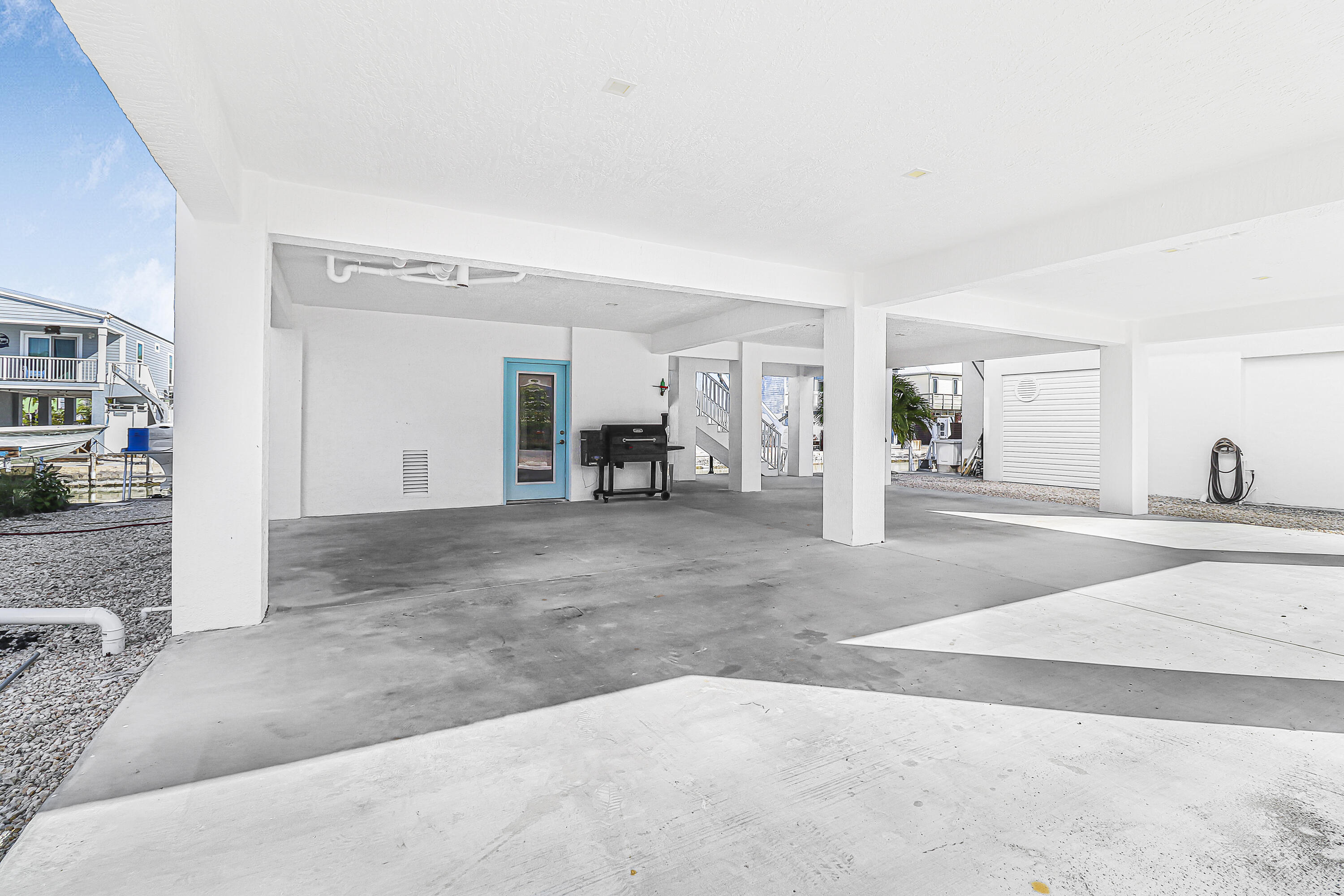 31575 Ave D Big Pine Key, FL 33043 - Photo 5 of 35 a view of a livingroom with wooden floor and furniture