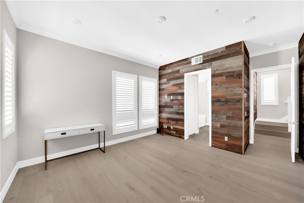 249 Chorus Irvine, CA 92618 - Photo 18 of 37 an empty room with a window and a ceiling fan