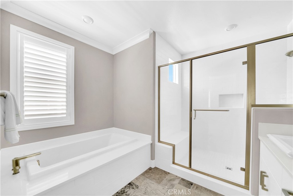 249 Chorus Irvine, CA 92618 - Photo 21 of 37 a spacious bathroom with a bathtub and a shower