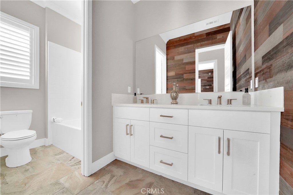 249 Chorus Irvine, CA 92618 - Photo 26 of 37 a bathroom with a sink toilet and mirror
