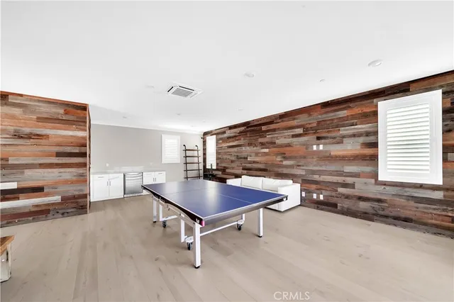 a living room with furniture a rug and a flat screen tv