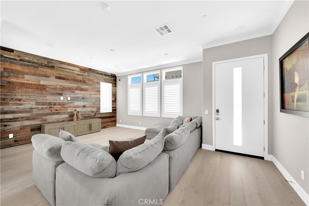 249 Chorus Irvine, CA 92618 - Photo 6 of 37 a living room with furniture and a large window