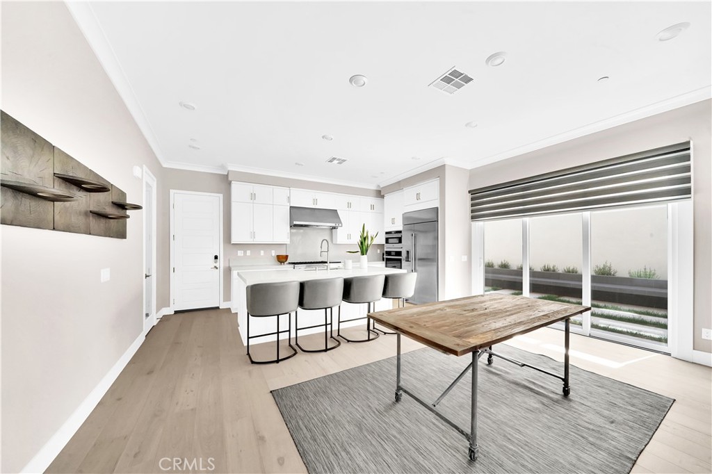 249 Chorus Irvine, CA 92618 - Photo 9 of 37 a living room with furniture and a wooden floor