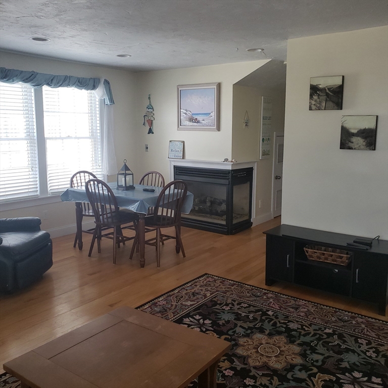 398 North End, Unit B Salisbury, MA 01952 - Photo 3 of 13 a living room with furniture and a window