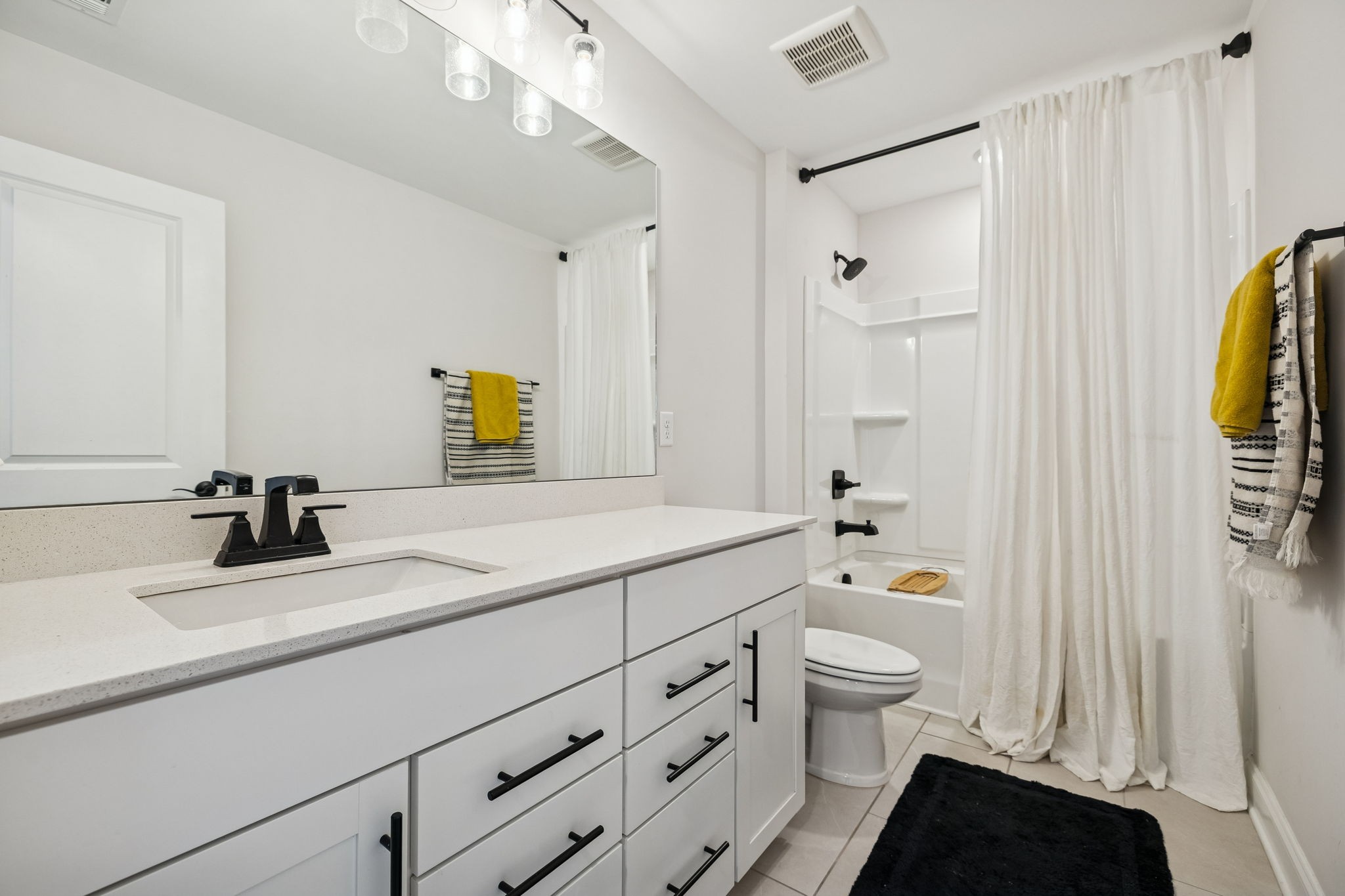 117 Timber Crest Trail White Bluff, TN 37187 - Photo 18 of 39 a bathroom with a sink a toilet and a large mirror