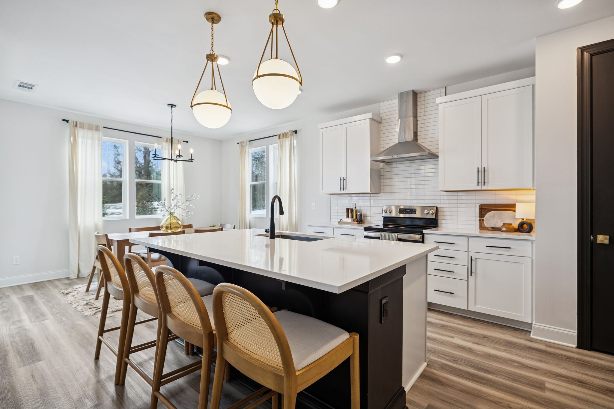 117 Timber Crest Trail White Bluff, TN 37187 - Photo 8 of 39 a kitchen with a dining table chairs sink and cabinets