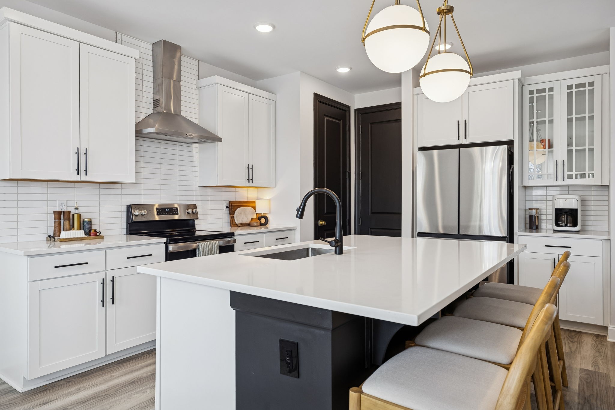 117 Timber Crest Trail White Bluff, TN 37187 - Photo 9 of 39 a kitchen with stainless steel appliances a stove a sink a refrigerator a center island and chairs