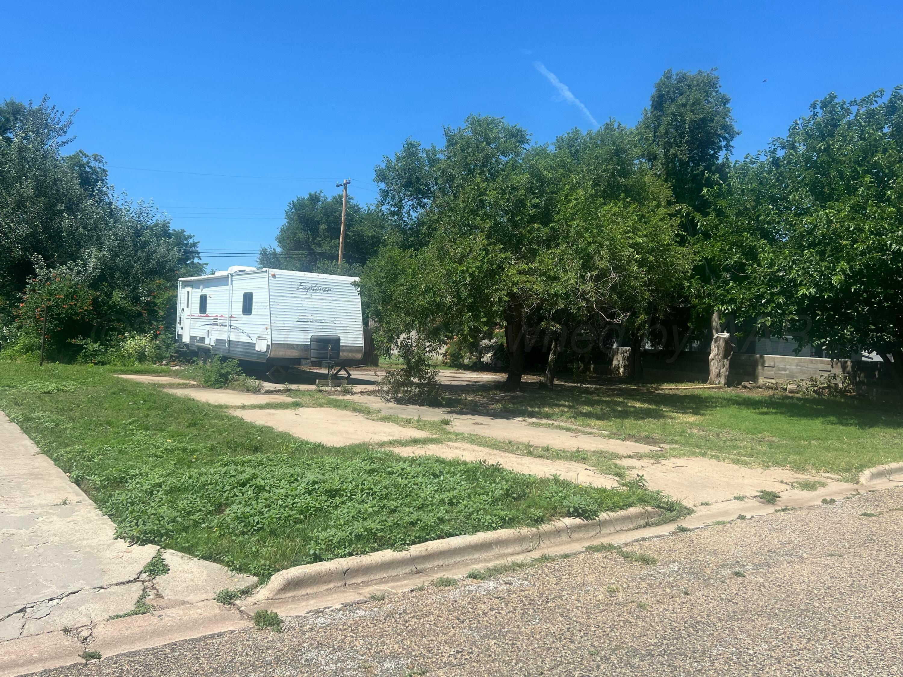 426 Santa Fe Street Borger, TX 79007 - Photo 1 of 3 a view of a house with backyard and trees