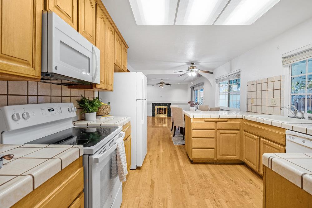 755 Cumberland Drive Gilroy, CA 95020 - Photo 12 of 52 a kitchen with stainless steel appliances granite countertop a sink and cabinets
