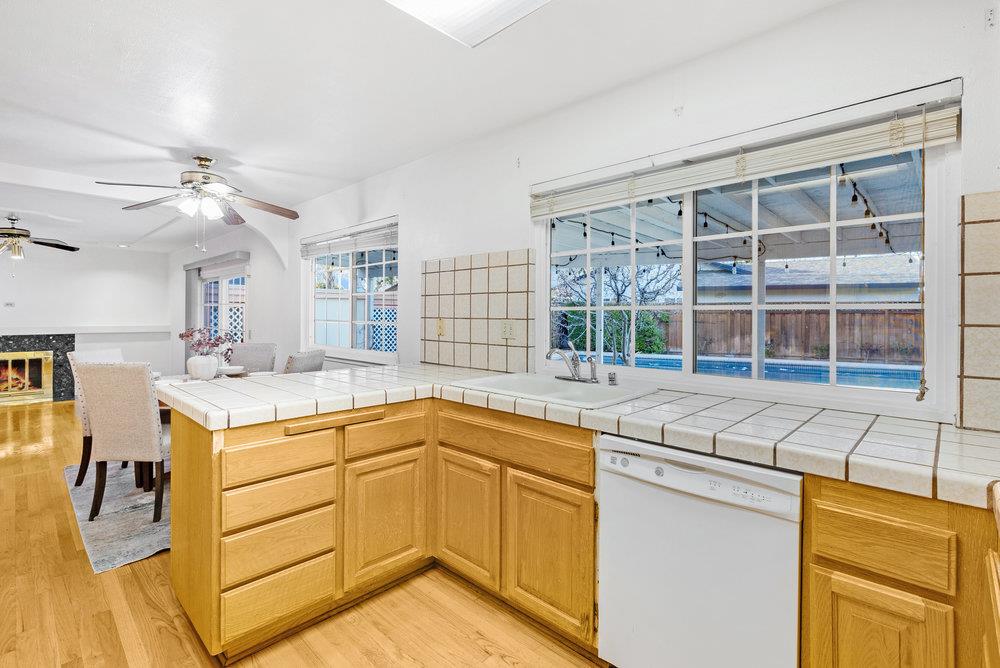 755 Cumberland Drive Gilroy, CA 95020 - Photo 13 of 52 a open kitchen with stainless steel appliances granite countertop a sink and cabinets