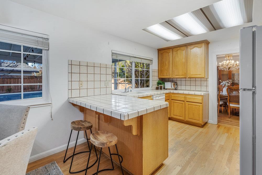 755 Cumberland Drive Gilroy, CA 95020 - Photo 16 of 52 a kitchen with stainless steel appliances granite countertop a stove and a refrigerator