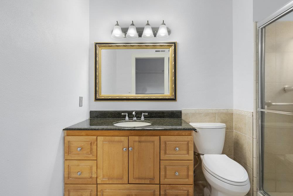 755 Cumberland Drive Gilroy, CA 95020 - Photo 32 of 52 a bathroom with a toilet sink and mirror