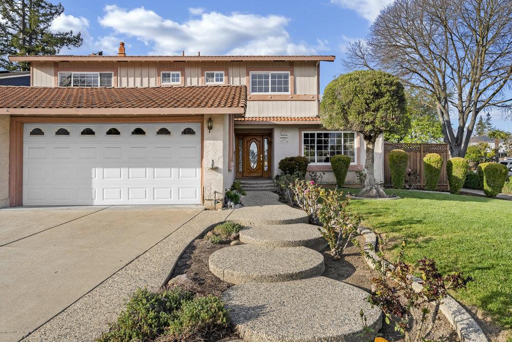 755 Cumberland Drive Gilroy, CA 95020 - Photo 4 of 52 a front view of a house with garden