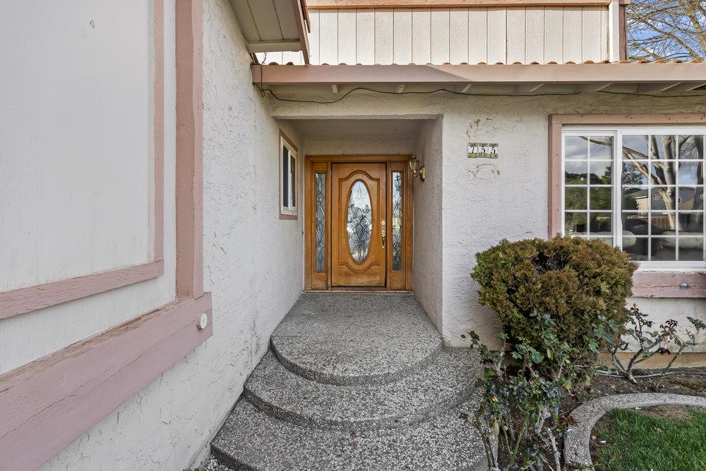 755 Cumberland Drive Gilroy, CA 95020 - Photo 6 of 52 a front view of a house with large windows