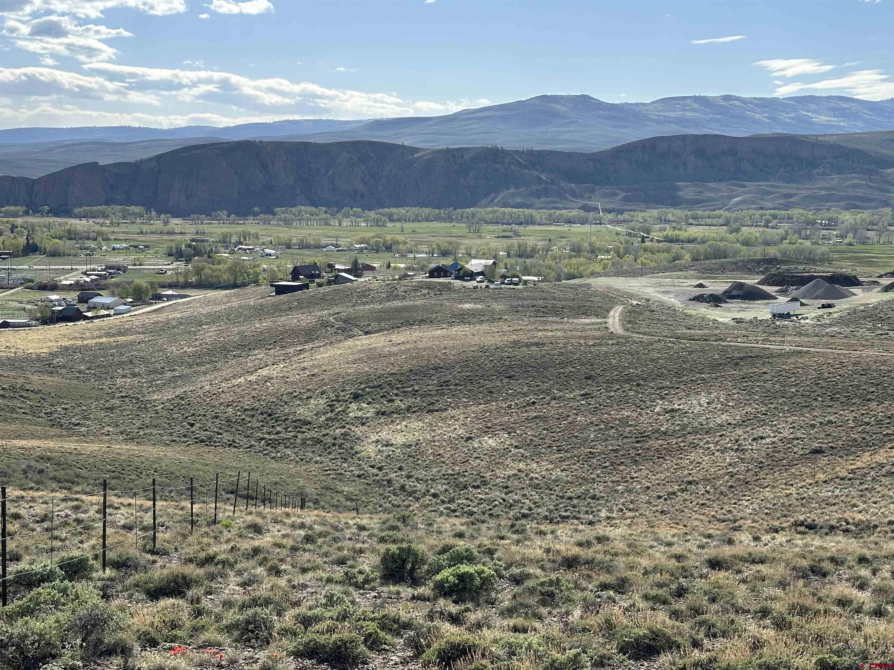 a view of an ocean with a mountain