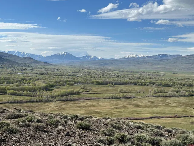 a view of ocean with mountains