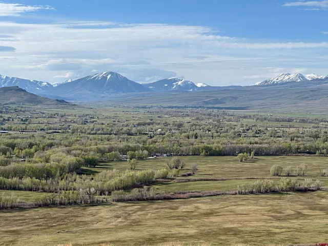 a view of ocean with mountain