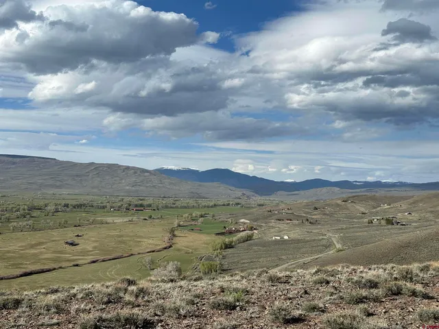 a view of mountain with lake