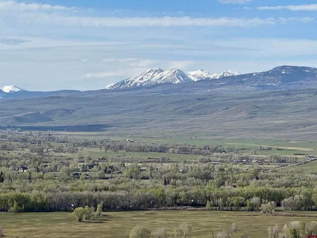 a view of ocean with a mountain