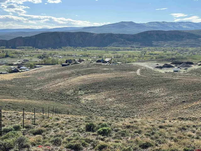a view of an ocean with a mountain