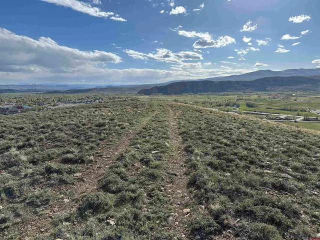 a view of mountain with sunset