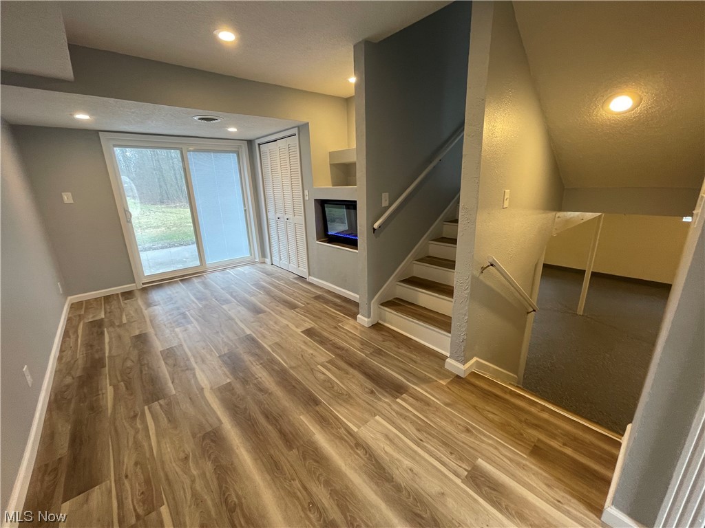 6135 California Road Williamsfield, OH 44093 - Photo 9 of 37 Stairs featuring hardwood / wood-style flooring