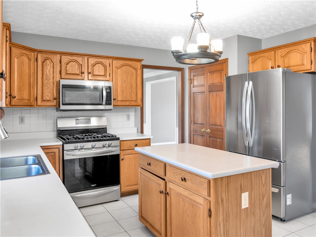 25 Callaway Springboro, OH 45066 - Photo 9 of 51 Bright and open, this kitchen features wood cabinetry and stainless steel appliances.