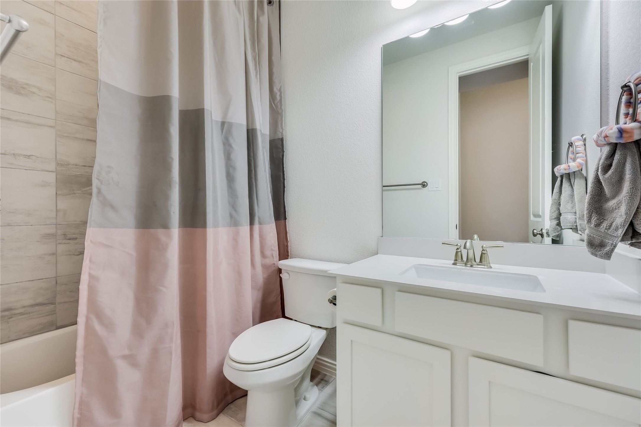 7705 Pace Ravine Drive Lago Vista, TX 78645 - Photo 22 of 40 Full bath with vanity and shower / bath combo with shower curtain