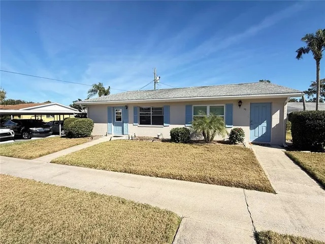 a front view of a house with entertaining space