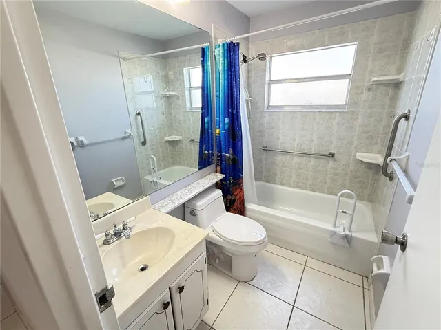 a bathroom with a sink a toilet and a bathtub