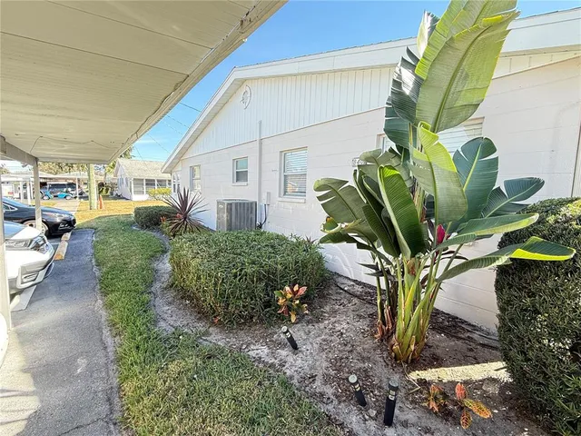 a swimming pool view with a seating space