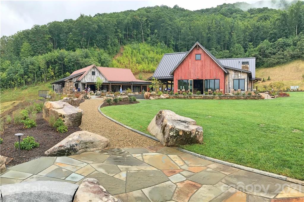 148 Preserve Road, Unit 148 Sylva, NC 28779 - Photo 7 of 11 a front view of a house with yard and green space