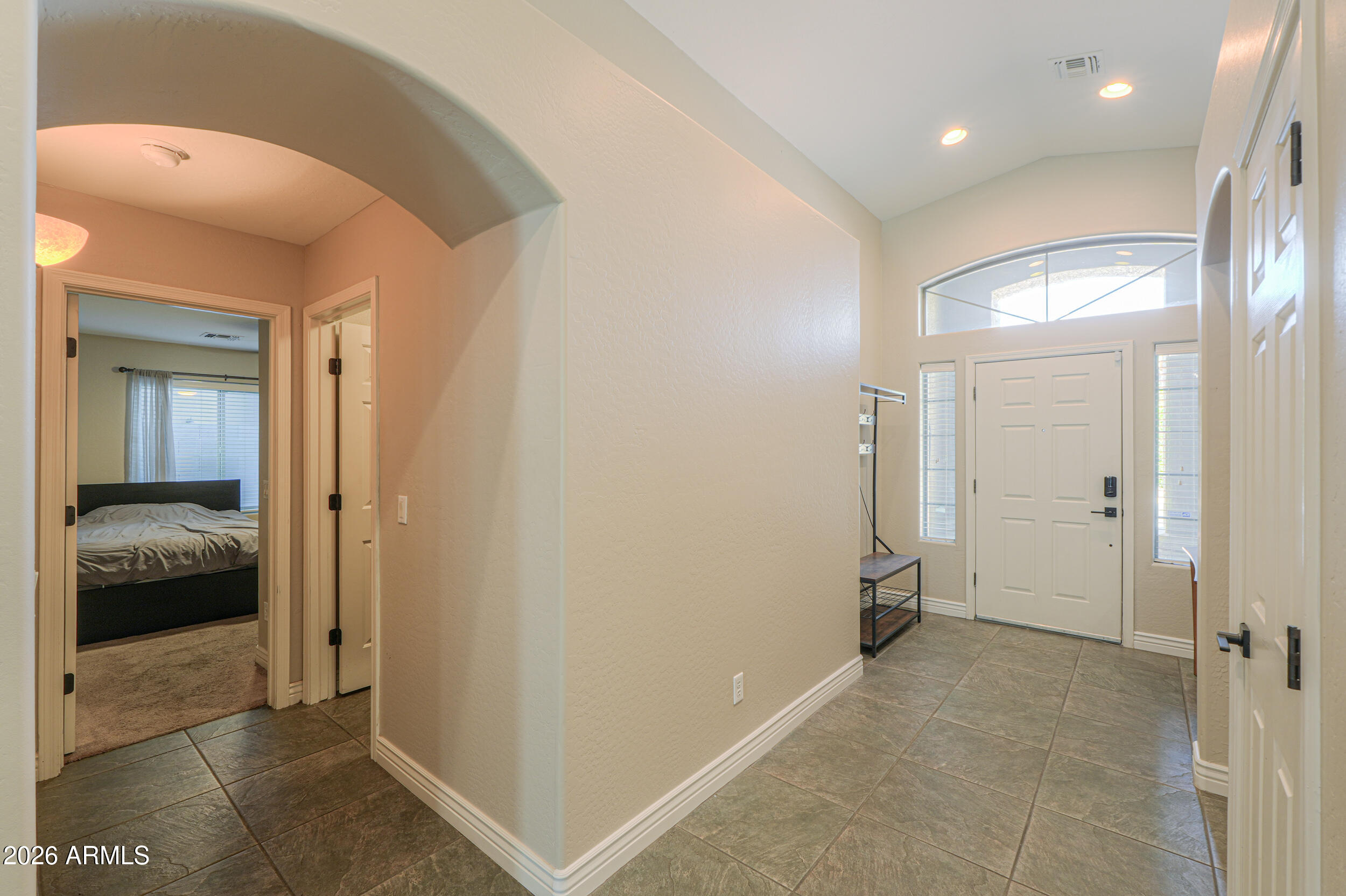 43843 Roth Road Maricopa, AZ 85138 - Photo 15 of 53 a view of a hallway with a bedroom
