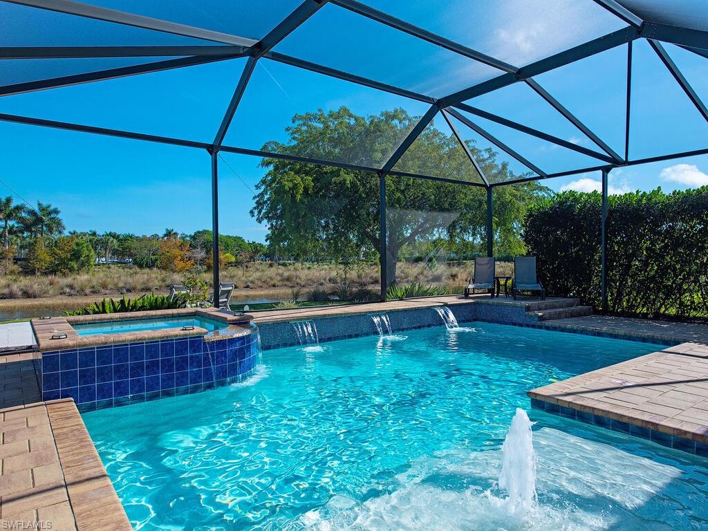 6482 Warwick Avenue Naples, FL 34113 - Photo 1 of 50 a view of a swimming pool with a patio