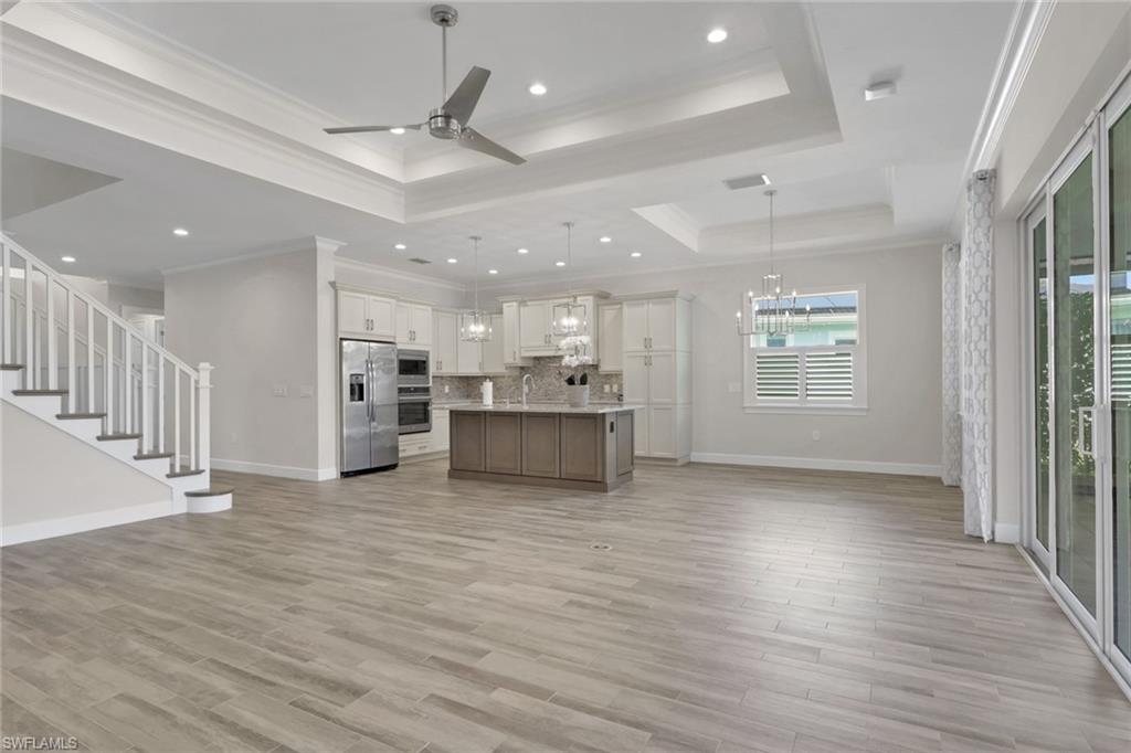 6482 Warwick Avenue Naples, FL 34113 - Photo 15 of 50 a view of kitchen with sink and wooden floor