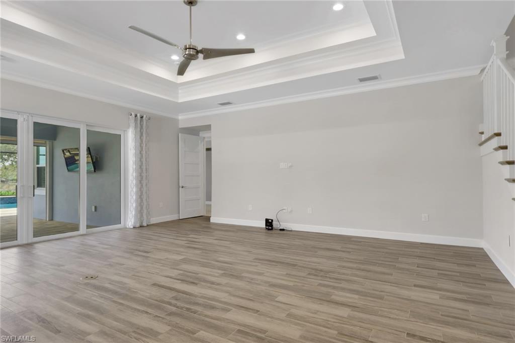 6482 Warwick Avenue Naples, FL 34113 - Photo 18 of 50 a view of a room with wooden floor
