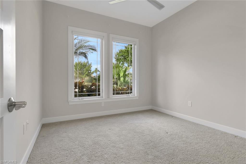 6482 Warwick Avenue Naples, FL 34113 - Photo 25 of 50 an empty room with windows