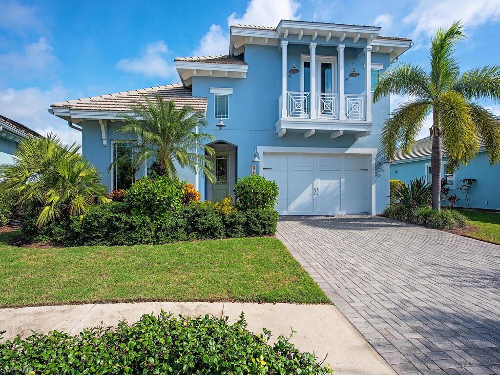 6482 Warwick Avenue Naples, FL 34113 - Photo 28 of 50 a front view of a house with a yard