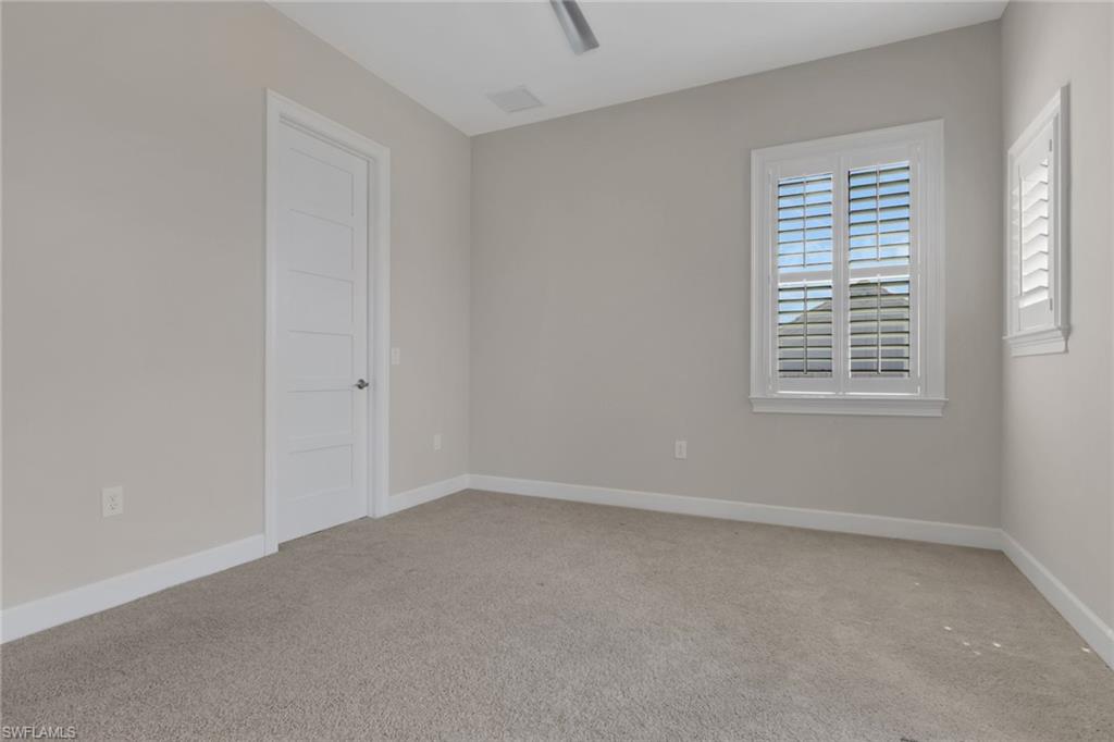 6482 Warwick Avenue Naples, FL 34113 - Photo 36 of 50 a view of an empty room with a window