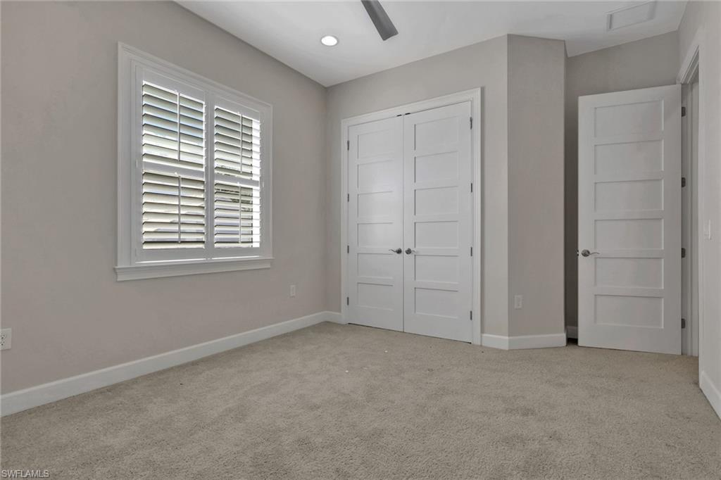 6482 Warwick Avenue Naples, FL 34113 - Photo 38 of 50 a view of an empty room with a window