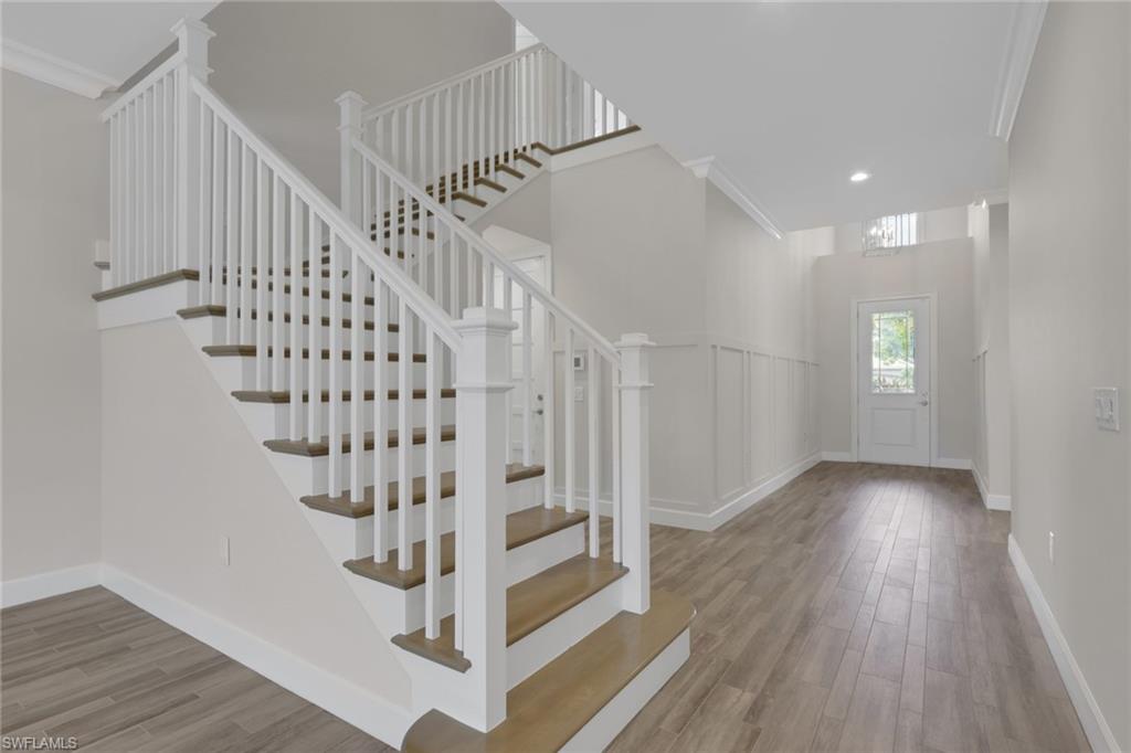 6482 Warwick Avenue Naples, FL 34113 - Photo 7 of 50 a view of entryway with wooden floor