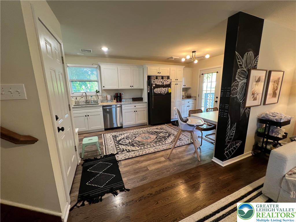 28 Harrison Street Emmaus, PA 18049 - Photo 3 of 15 a kitchen with stainless steel appliances kitchen island granite countertop a stove refrigerator and cabinets