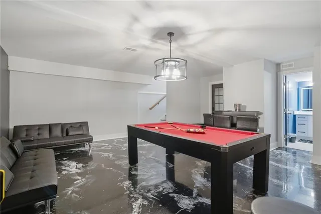 a room with furniture and kitchen view