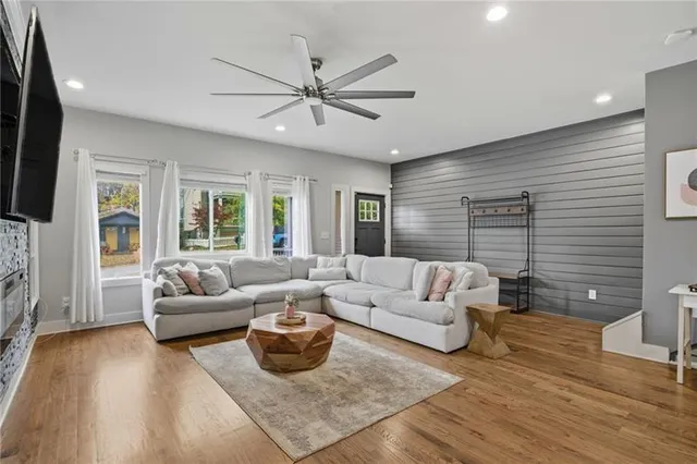 a living room with furniture and a flat screen tv