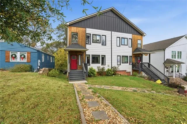 a front view of a house with garden