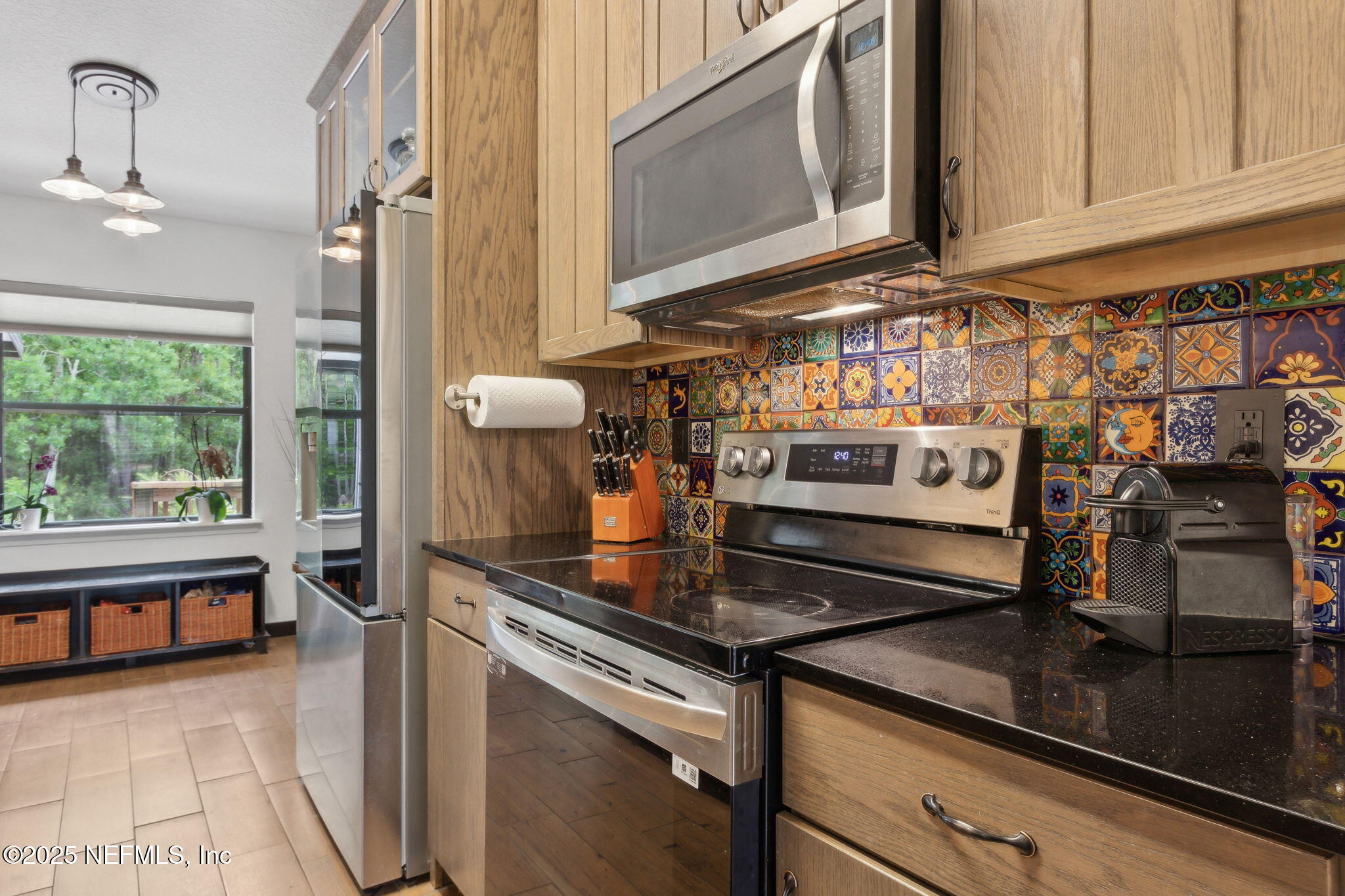 944 North Lilac Loop St. Johns, FL 32259 - Photo 13 of 55 a kitchen with stainless steel appliances granite countertop a sink and a stove